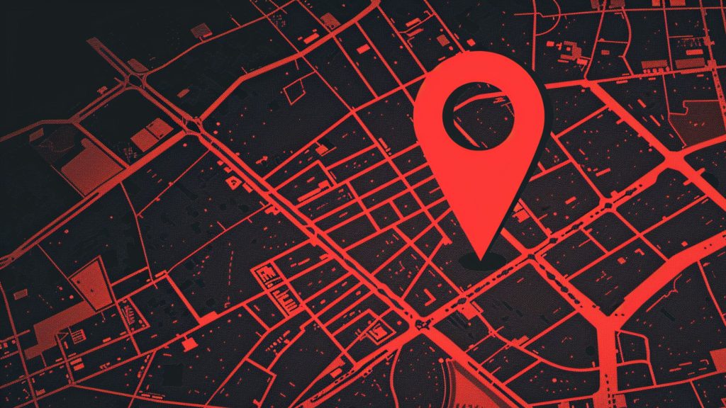 Red and black digital map with a large red location pin marking a spot on the grid-like street layout.